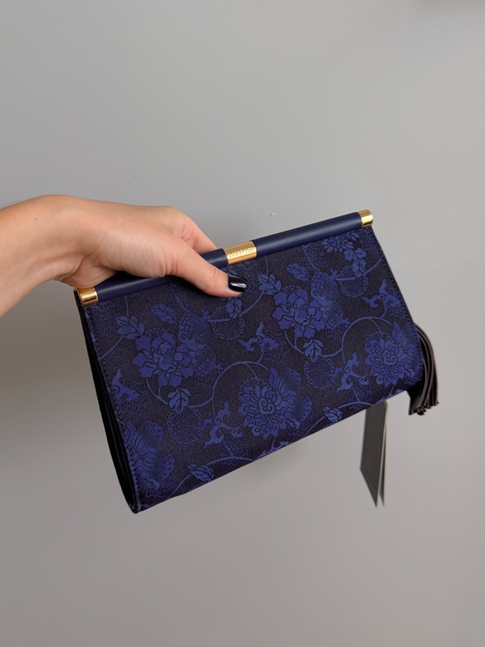 Dark blue silk evening bag with a tassel